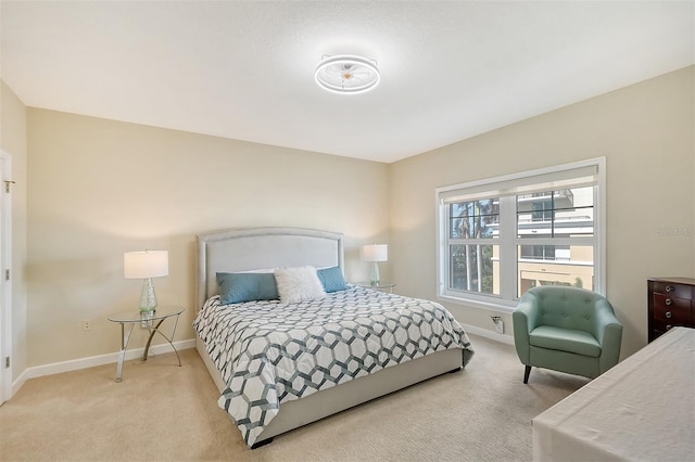 bedroom featuring light carpet