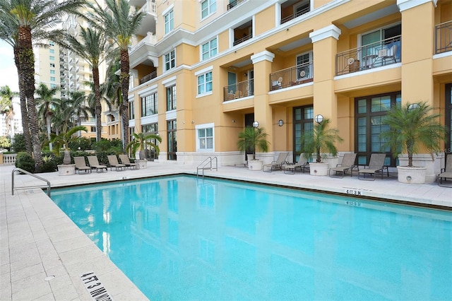 view of pool featuring a patio