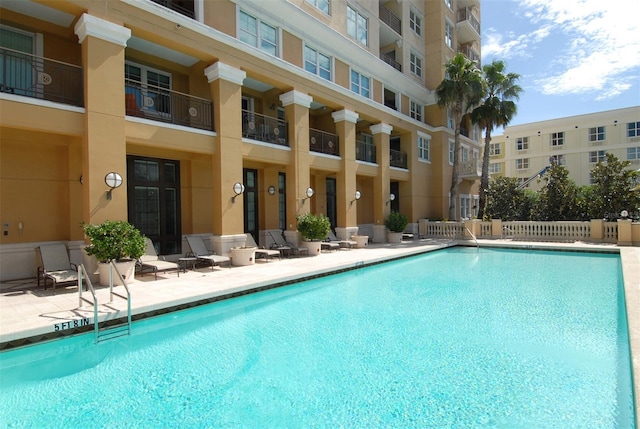 view of swimming pool with a patio area