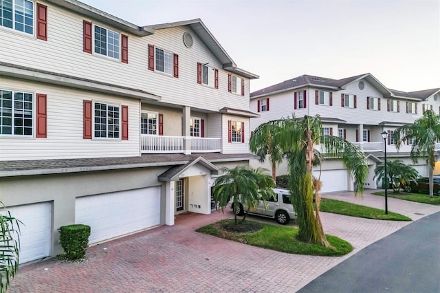 townhome / multi-family property featuring a garage