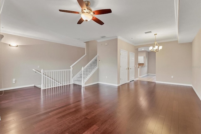 unfurnished living room featuring ceiling fan with notable chandelier, crown molding, and dark wood-type flooring