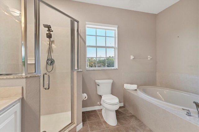 full bathroom featuring tile patterned flooring, shower with separate bathtub, vanity, and toilet