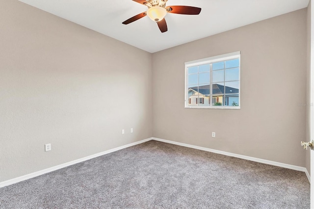 spare room with carpet floors and ceiling fan