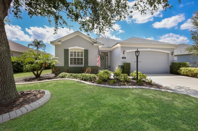 ranch-style home with a garage and a front lawn