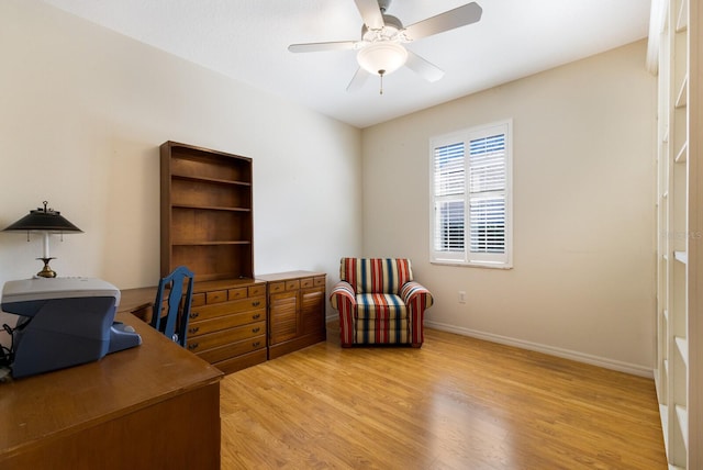 home office featuring ceiling fan and light hardwood / wood-style flooring