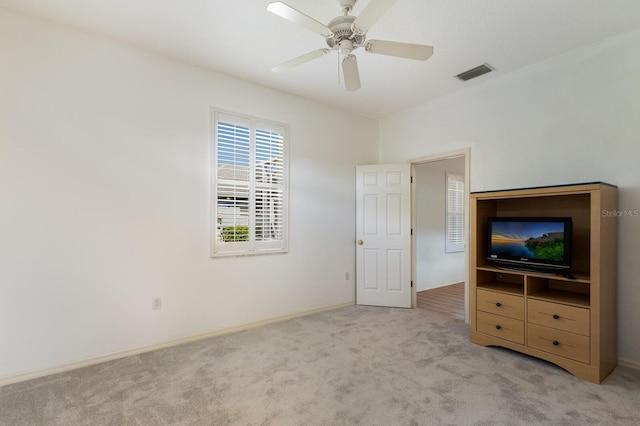 unfurnished bedroom with light carpet and ceiling fan