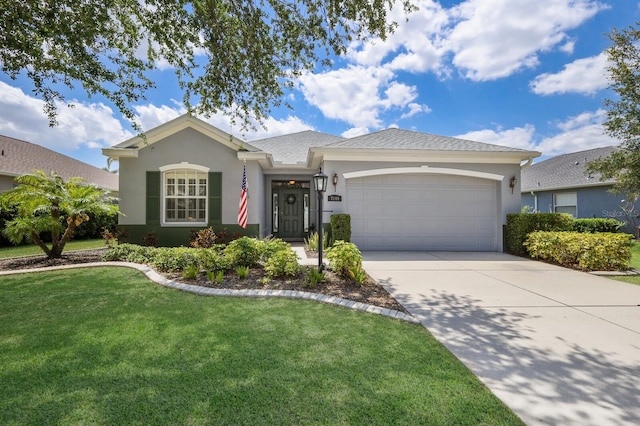 ranch-style house featuring a garage and a front yard