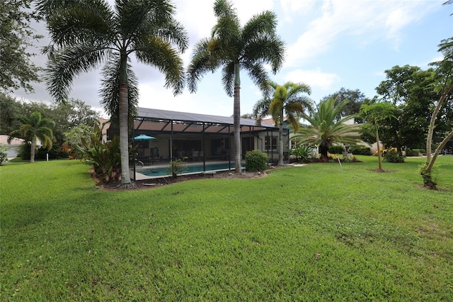 view of yard featuring glass enclosure