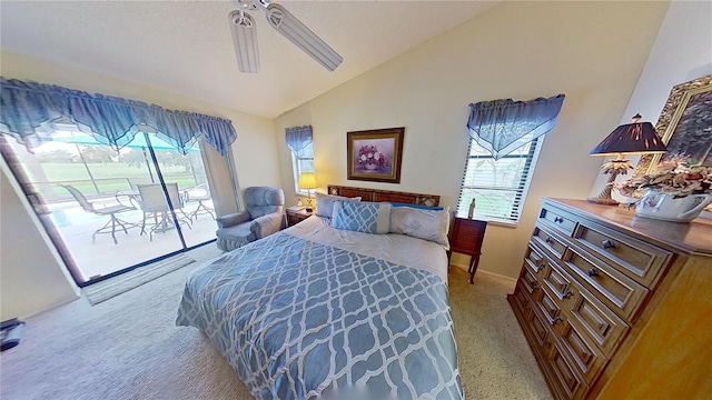 bedroom featuring access to outside, ceiling fan, lofted ceiling, and light colored carpet