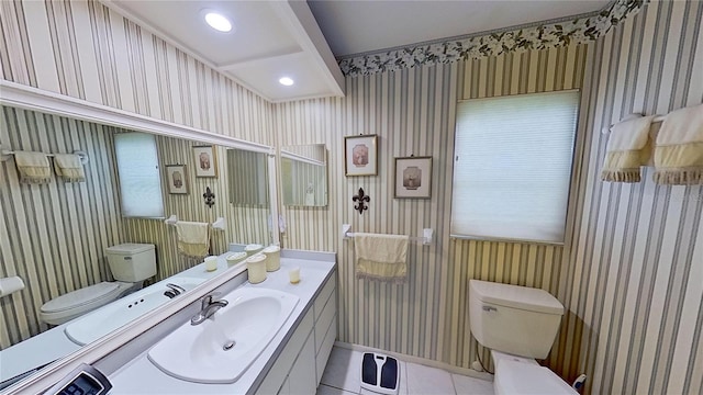 bathroom featuring tile patterned floors, vanity, and toilet