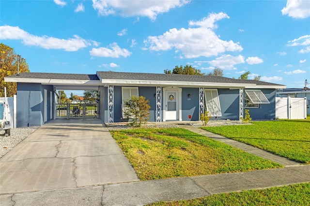 ranch-style house featuring a carport and a front yard