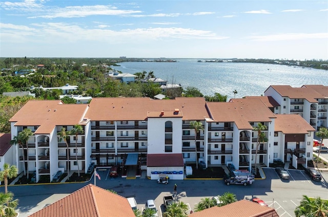 birds eye view of property with a water view