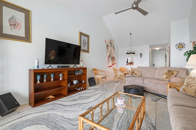 carpeted living room with ceiling fan and vaulted ceiling