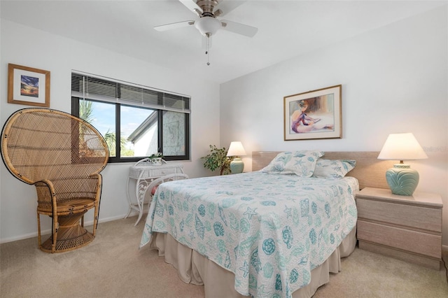 bedroom featuring light colored carpet and ceiling fan