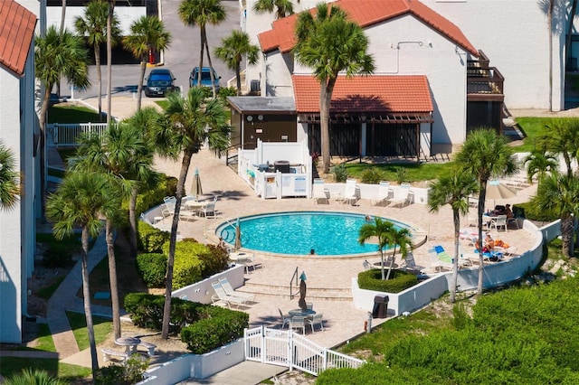 view of swimming pool with a patio