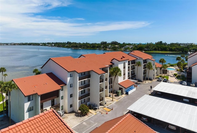 birds eye view of property with a water view