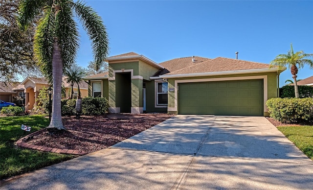 10550 Old Grove Cir, Bradenton, FL 34212 - view of front of home featuring stucco siding, concrete driveway, and an attached garage