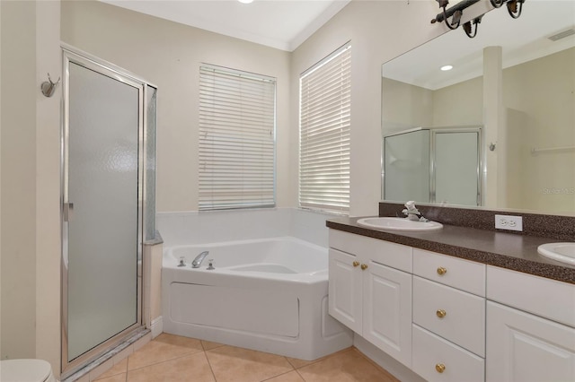 10550 Old Grove Cir, Bradenton, FL 34212 - full bath with a stall shower, double vanity, a garden tub, tile patterned floors, and toilet