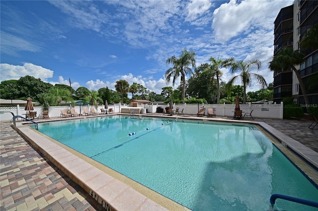 view of swimming pool with a patio area