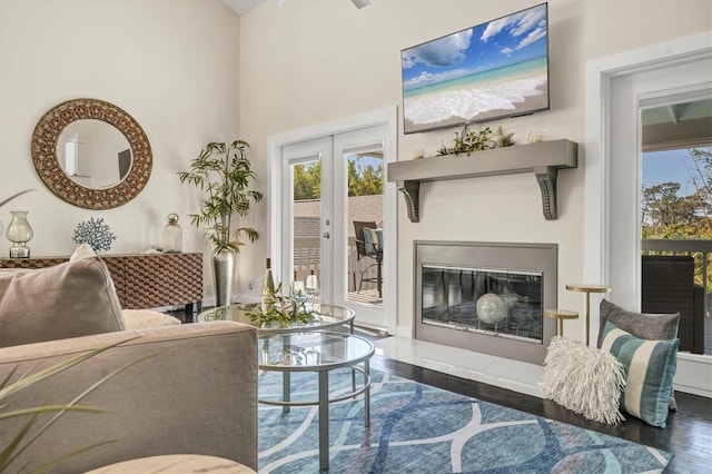 sitting room with hardwood / wood-style flooring and french doors