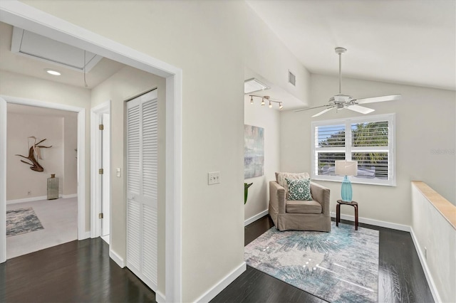 interior space featuring lofted ceiling, ceiling fan, and dark hardwood / wood-style floors