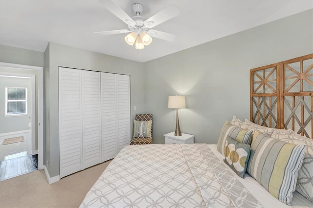 bedroom with light carpet, a closet, and ceiling fan