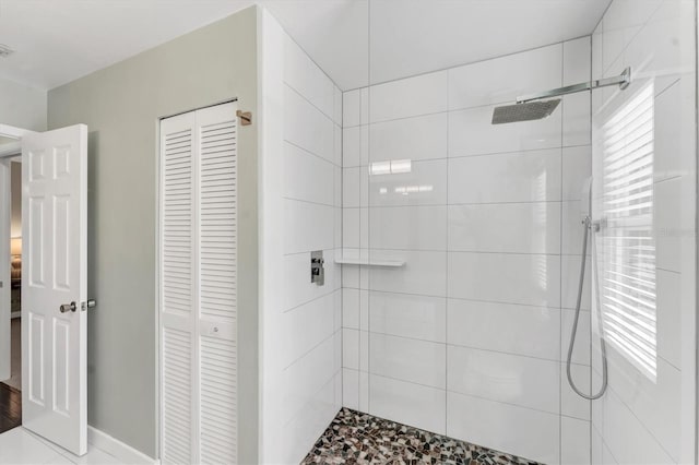 bathroom with tiled shower