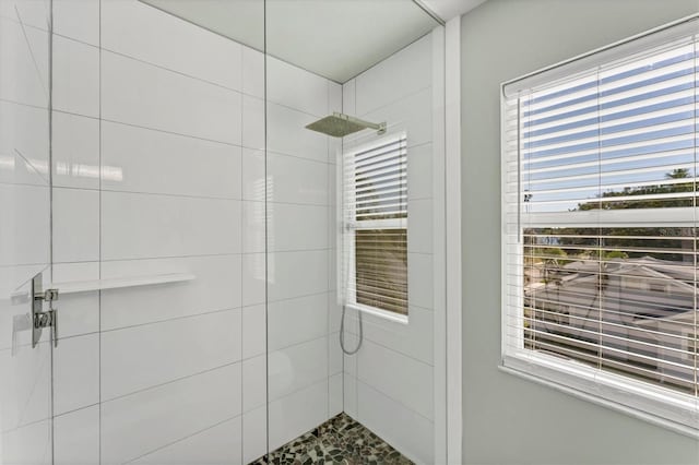 bathroom with a tile shower