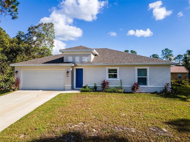 view of front of home featuring a front lawn and a garage