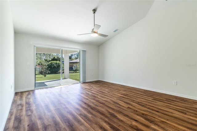 spare room with dark wood-type flooring, ceiling fan, and vaulted ceiling