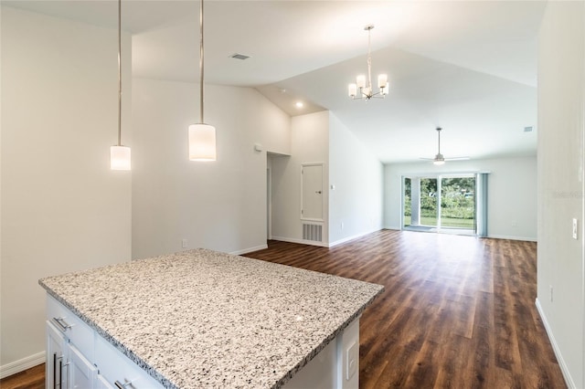 kitchen with white cabinetry, ceiling fan with notable chandelier, dark wood-type flooring, and pendant lighting