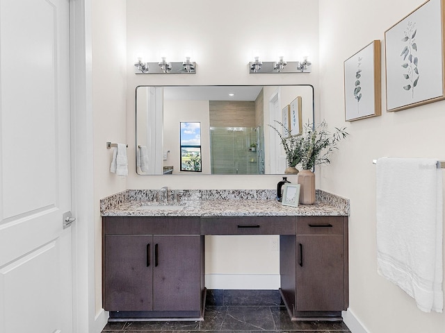 bathroom featuring vanity, tile patterned floors, and a shower with door