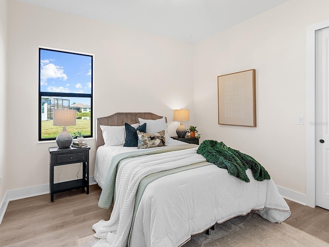 bedroom with light hardwood / wood-style floors