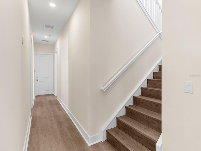 stairs with wood-type flooring