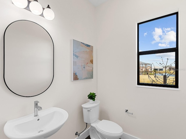 bathroom with sink and toilet