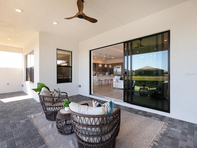 view of patio with ceiling fan