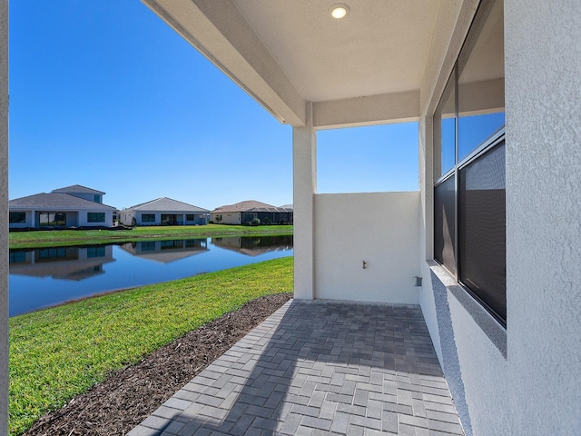 view of patio / terrace featuring a water view