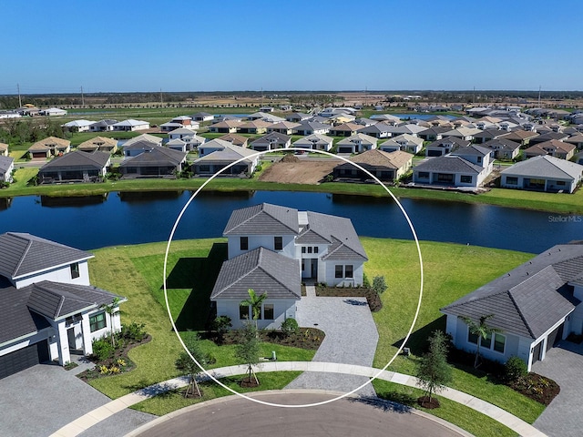 birds eye view of property with a water view