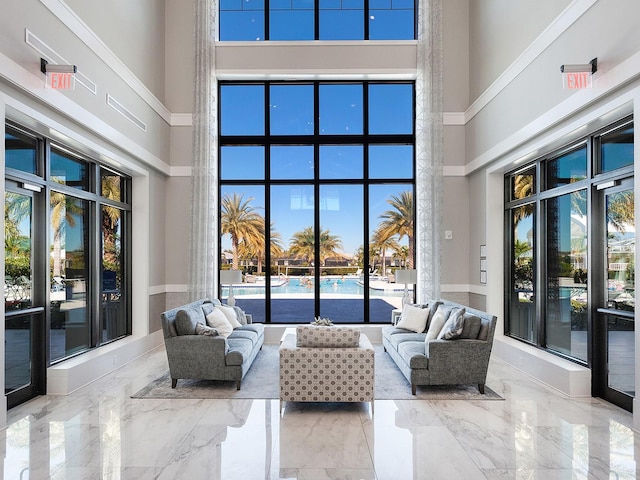 living room featuring a high ceiling