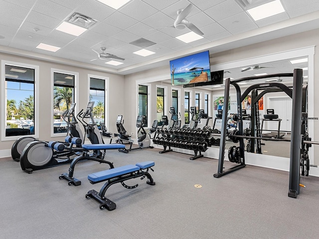 exercise room featuring a paneled ceiling