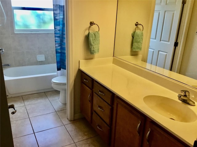 full bathroom with tile patterned flooring, shower / bath combo, vanity, and toilet