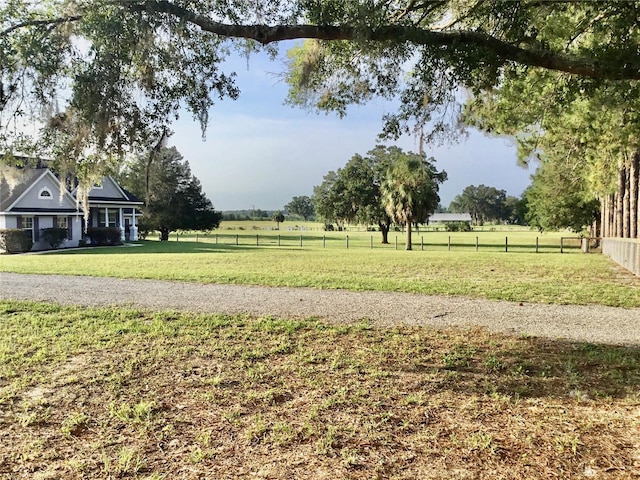 view of yard with a rural view