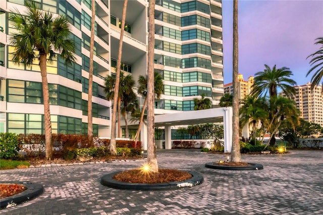 view of outdoor building at dusk