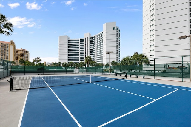 view of sport court featuring basketball hoop