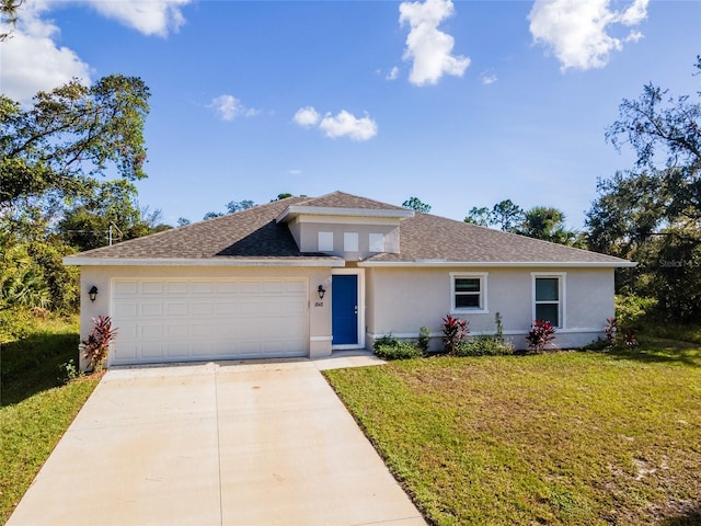 view of front of house with a garage and a front yard