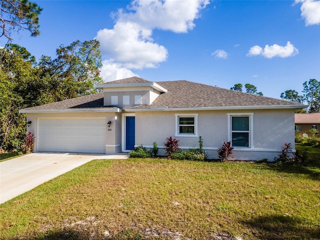 view of front of property featuring a front yard and a garage