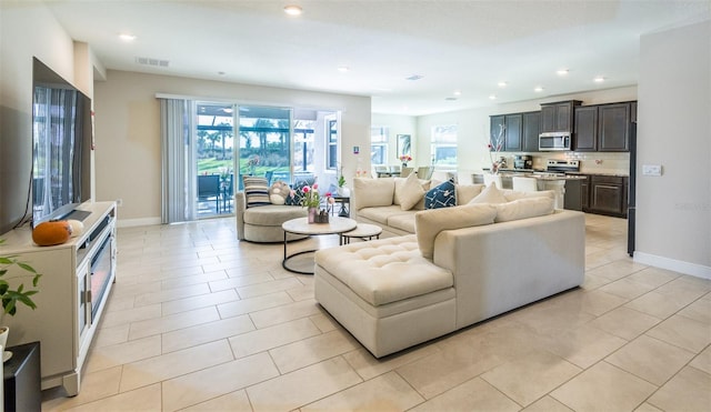 living room featuring light tile patterned flooring