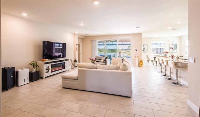 tiled living room featuring sink