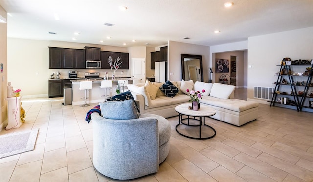 living room featuring light tile patterned flooring