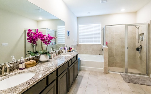 bathroom featuring tile patterned flooring, vanity, and independent shower and bath